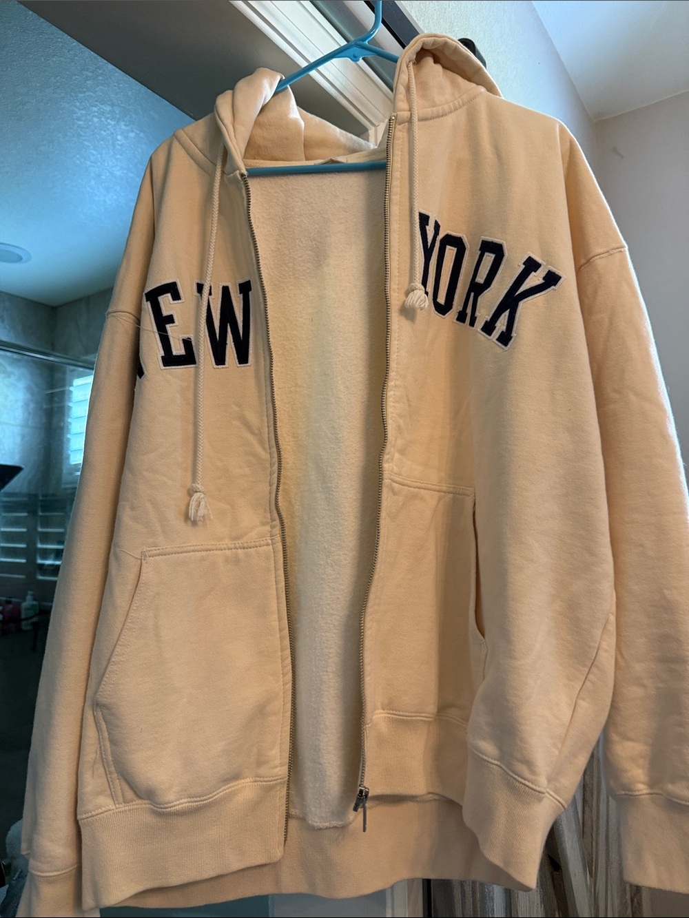 Cream Zip-Up Hoodie with 'NEW YORK' Chest Script